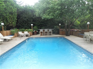 Pool with deck and sunning chairs